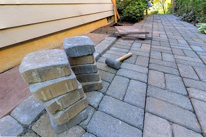 Patio under construction with brick pavers