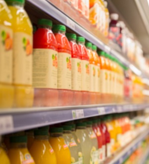 Plastic bottles of juice on a grocery shelf