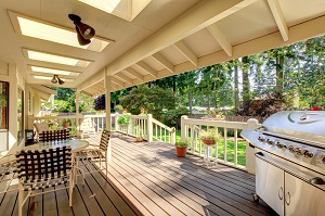 Covered deck with patio furniture and grill