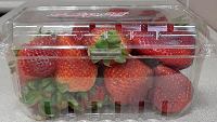 Clear plastic clamshell packaged with strawberries