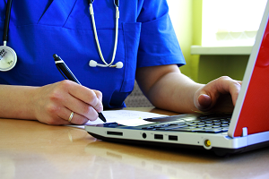 Picture of Doctor works on Computer