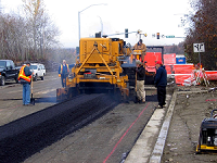 Asphalt truck paving road