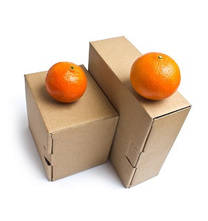 Fresh oranges on two corrugated boxes