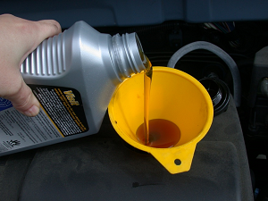 Motorcycle Lubricant Pouring Out of Bottle