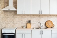 Kitchen with white cupboards