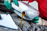 Oil being poured into an engine