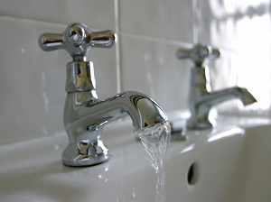 Two faucets with one running water