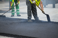 Asphalt being spread