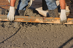 Global Cement & Concrete Additives Construction Worker with Cement