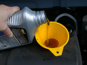 Global Motorcycle Lubricants Motorcycle Lubricant Pouring Out of Bottle