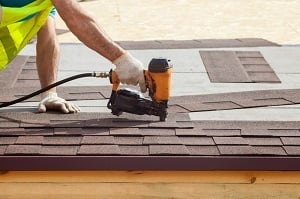 Roofing Accessories Roofer putting on shingles